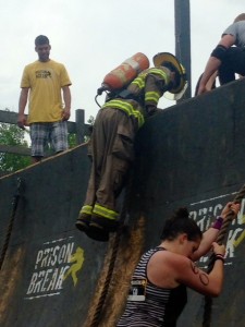 Firefighter Alex Lantanville from Beeton working his way over the last obstacle of the course.