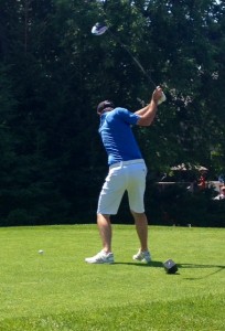 Pro golfer Nic Taylor teeing off at the 1st hole