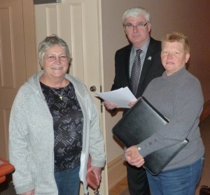 Photo by Marni Walsh Heather Holmes (right) speaks to Town of Shelburne CAO John Telfer after she and her husband Greg Holmes presented a delegation to Council asking for support for the Pickin' in the Park endeavour to build a pole barn structure at Fiddle Park in Shelburne. The organization was supported by the Shelburne Kinettes represented at the meeting by Carol Egan (left.)