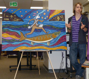 Jordan Williams from Centre Dufferin High School introduces the audience to the ideas of respect behind this work of art from The Mural Project which follows the story of “Nenaboozhoo and the Fish.” This stunning piece is one of three murals CDDHS students spent many hours painting last week, working under the direction of internationally acclaimed visual artist Christi Belcourt. Upper Grand District School Board Native Studies lead Colinda Clyne says Christi Belcourt is “one of the best known living indigenous artists in the country; her work is in the National Gallery, on Parliament Hill, and at the Art Gallery of Ontario; she is the creator of the Walking with Our Sisters travelling art show that honours missing and murdered indigenous women; she has designed PanAm medals, and has had her artwork reproduced onto clothing by Italian fashion designer Valentino.” The CDDHS students had the honour of working throughout the week with Belcourt  – painting the murals to express the messages of humanity and stewardship they had learned from First Nation's stories as told by Isaac Murdoch. 